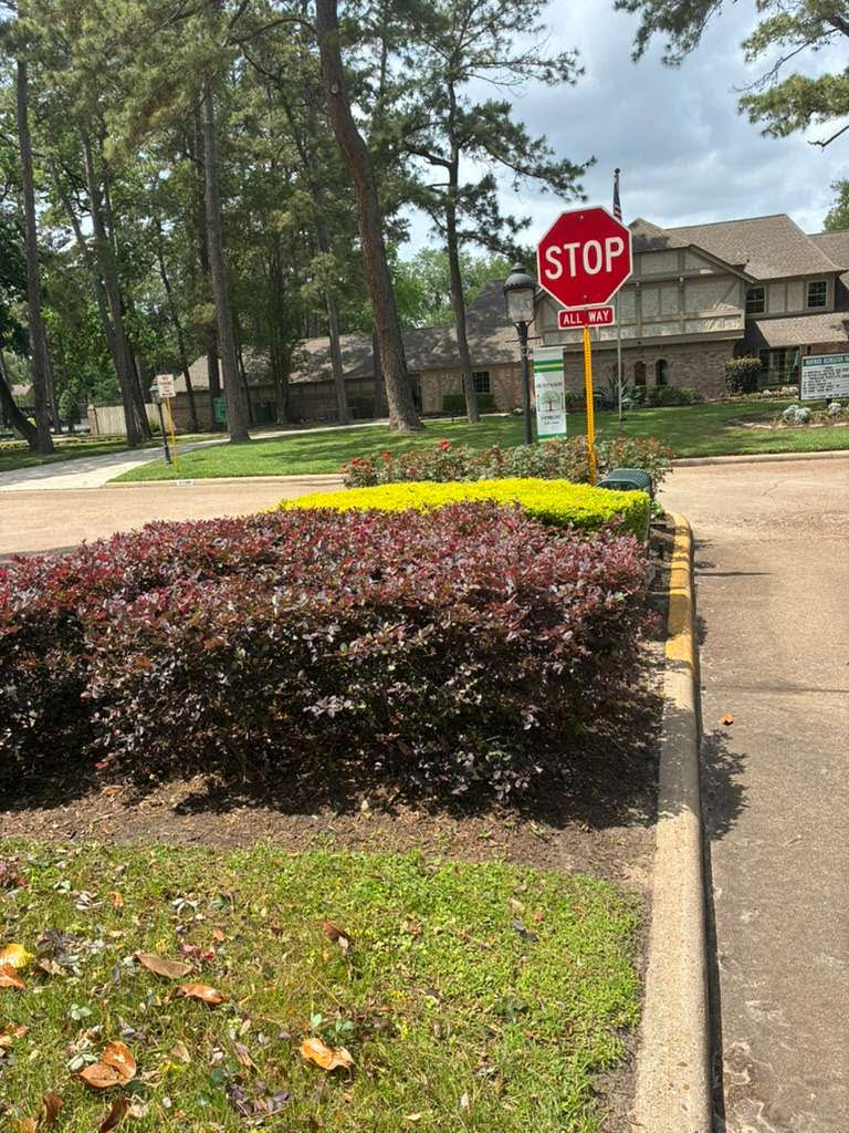 Colorful community entrance bed with seasonal plantings by TruLeaf